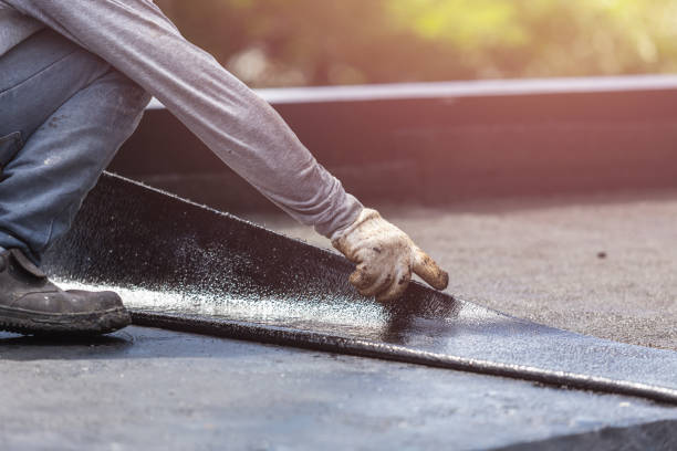 Professional Basement Waterproofing technician working in Georgetown, IL
